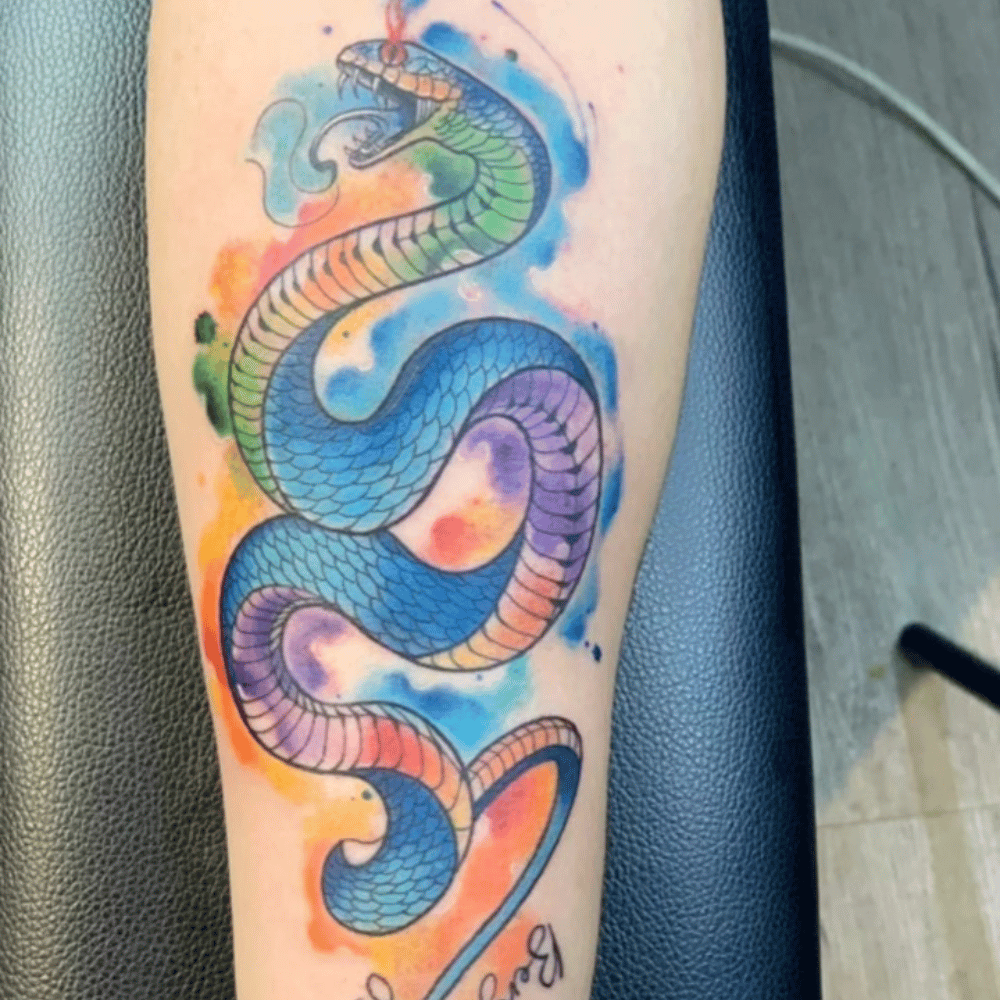 Watercolour Snake Tattoo Source @ha_tattooist via Instagram