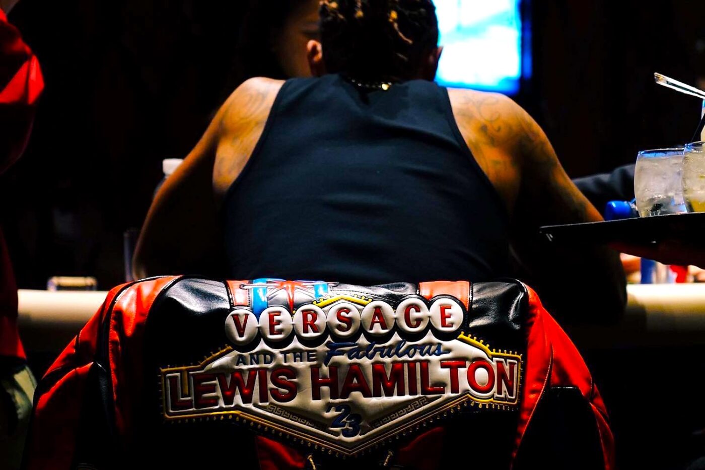 Lewis Hamilton wearing his Versace Las Vegas leather jacket. 
